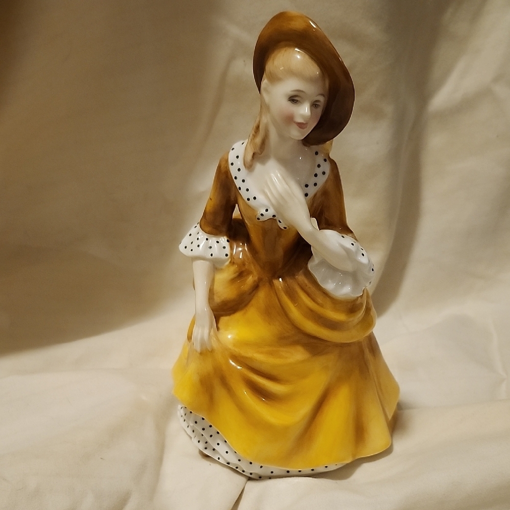 Royal Doulton Yellow and White Ceramic Figurine